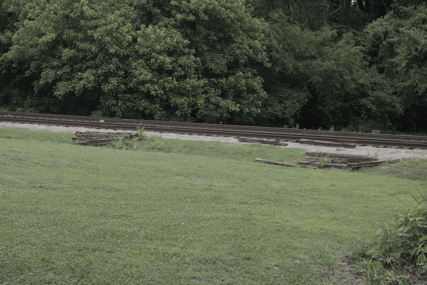 Railroad tracks adjacent to the walk