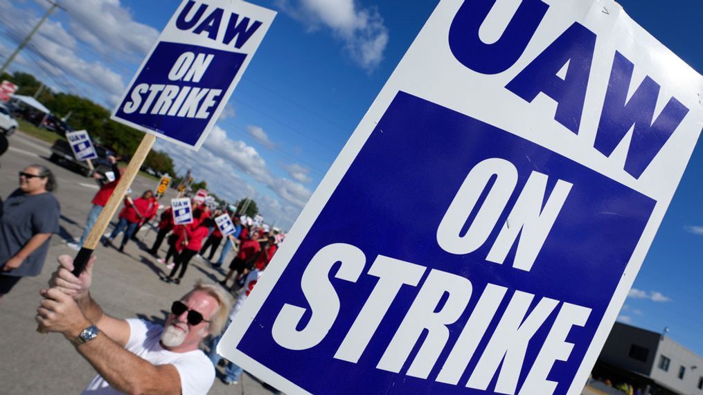 FILE - United Auto Workers members walk the picket line at the Ford Michigan Assembly Plant in Wayne, Mich., Monday, Sept. 18, 2023. So far the strike is limited to about 13,000 workers at three factories — one each at GM, Ford and Stellantis. (AP Photo/Paul Sancya)