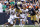 SOUTH BEND, INDIANA - SEPTEMBER 16: Audric Estime #7 of the Notre Dame Fighting Irish huddles over De'Javion Stepney #5 of the Central Michigan Chippewas during the second half at Notre Dame Stadium on September 16, 2023 in South Bend, Indiana. (Photo by Justin Casterline/Getty Images)