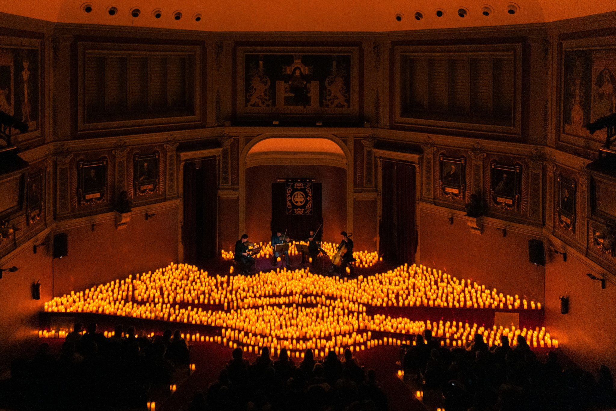 thousands of candles surrounding performers