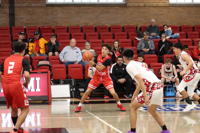 Loving's Bobby Parraz (left) waits for a pass during a game Jan. 27, 2024 game versus New Mexico Military Institute in Roswell.