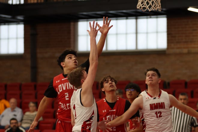 Loving's Bobby Parraz drives to the basket against New Mexico Military Institute defenders during a Jan. 27, 2024 game in Roswell. The Falcons won.