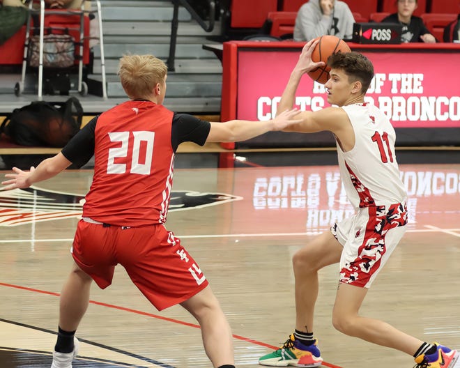 Loving's JD King (left) guards New Mexico Military's Cole Seidenberger during a game on Jan. 27, 2024 in Roswell.