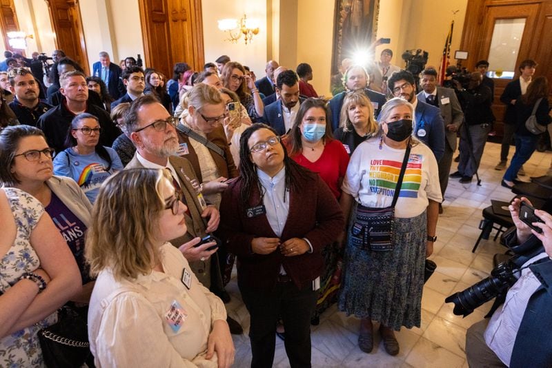 Activists for trans rights, including Sen. Kim Jackson (center), D-Stone Mountain, watch the voting for House Bill 1170.